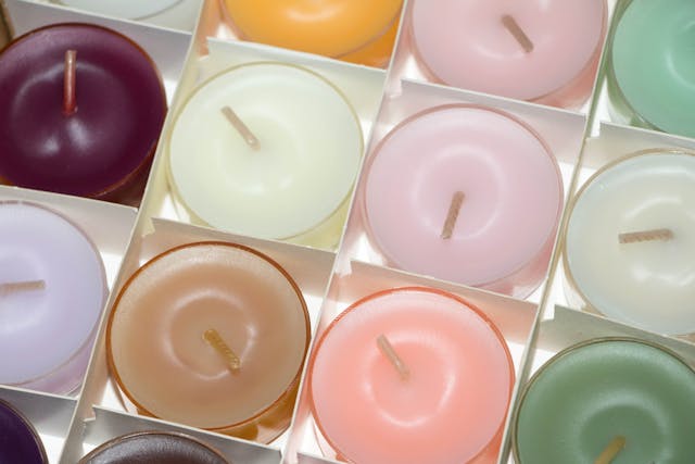 Lit scented candles creating a warm and cosy atmosphere at home